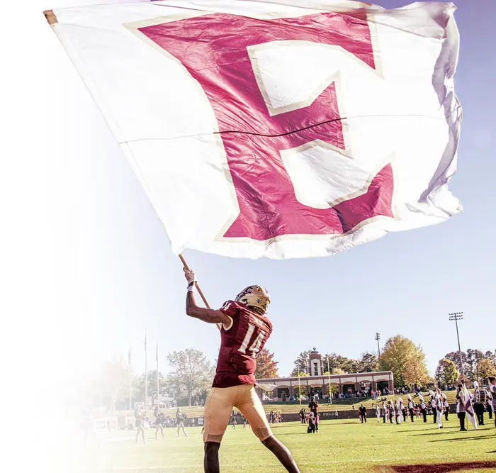 Football player carrying flag