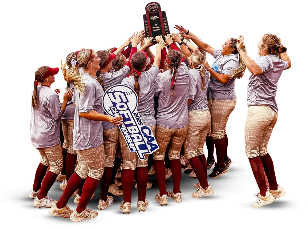 Softball players holding up trophy