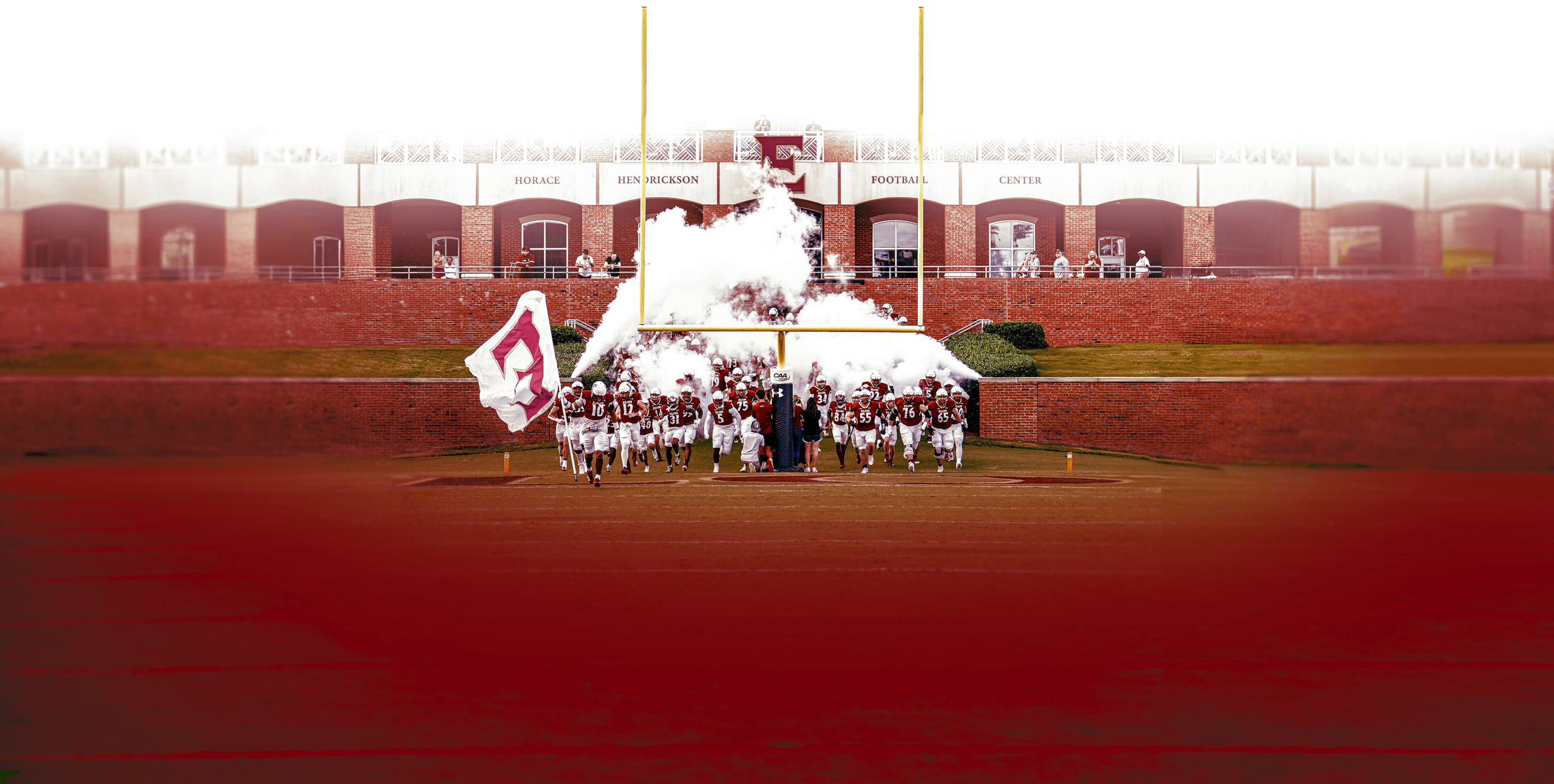 football players running onto field